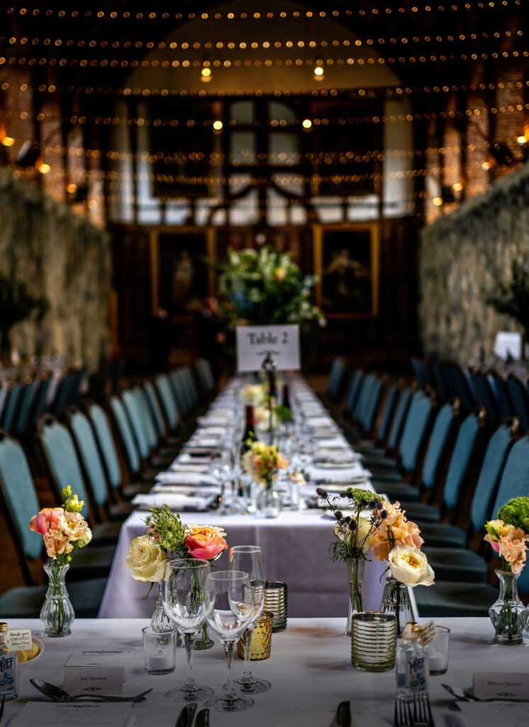A long banquet table set for a wedding breakfast in the Old Palace, Hatfield House