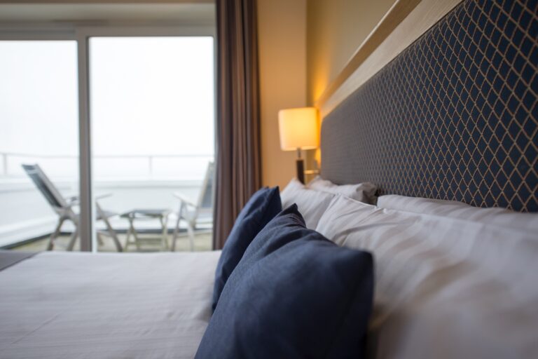 A bedroom with a sea-view balcony, The Haven Hotel, Poole