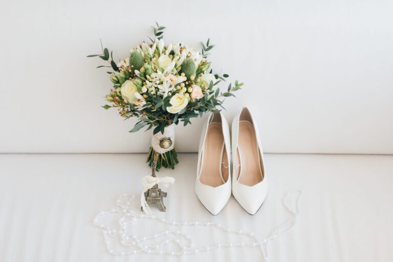 Bridal bouquet, pearls and white shoes laid out on the morning of a wedding, Haycock Manor