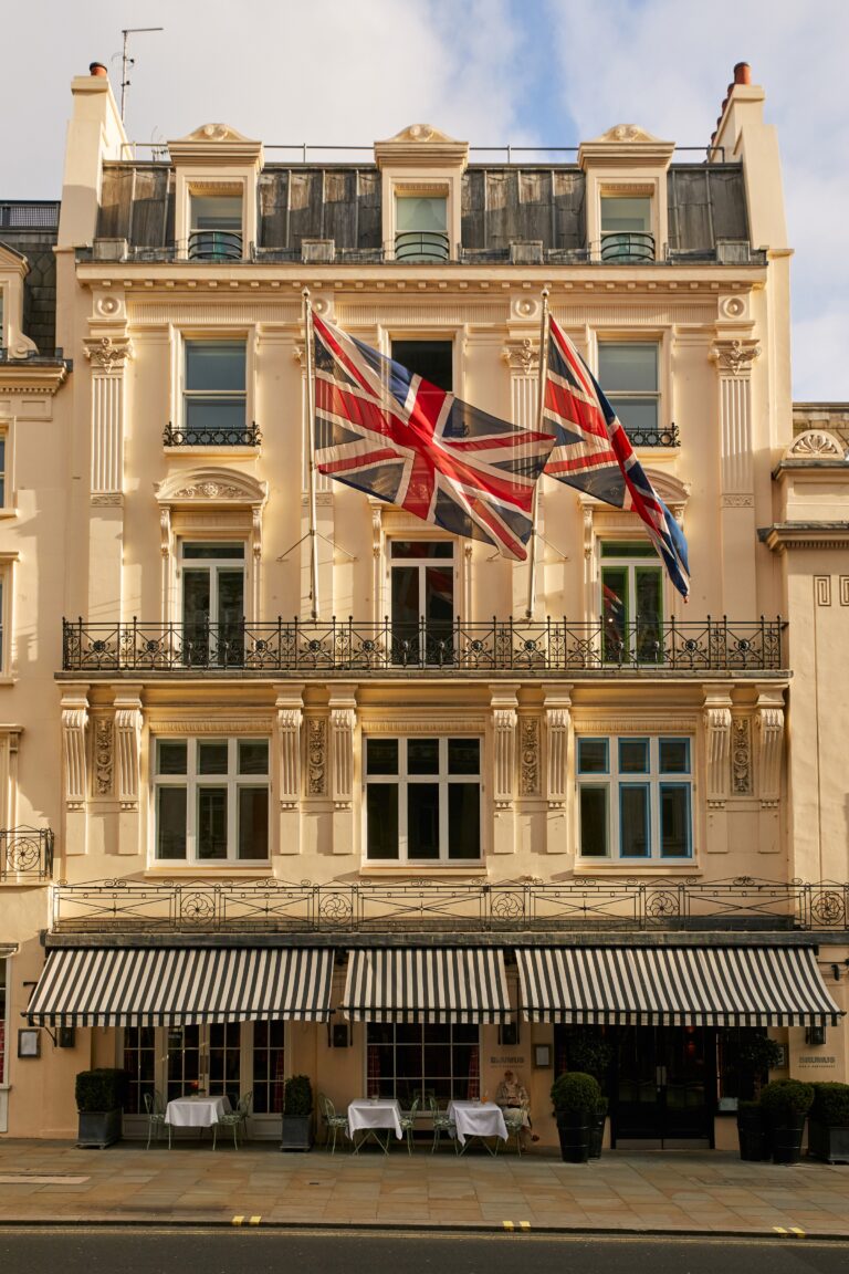 The Regency facade off Haymarket, with awning and Union Jack in the West End, Haymarket Hotel