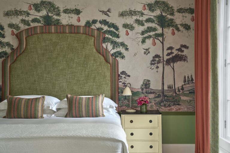 A Luxury Junior Suite, with a green mural wall, Haymarket Hotel