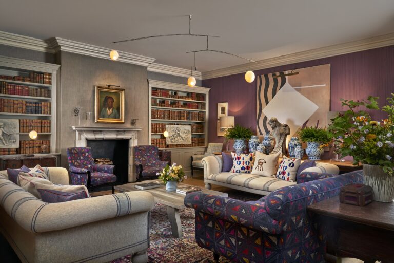 The Library, its purple honesty bar and bookshelves, Haymarket Hotel