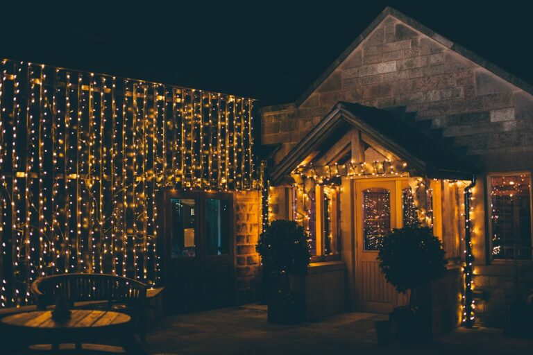 The barn frontage at night, covered in curtains of fairy lights, Heaton House Farm