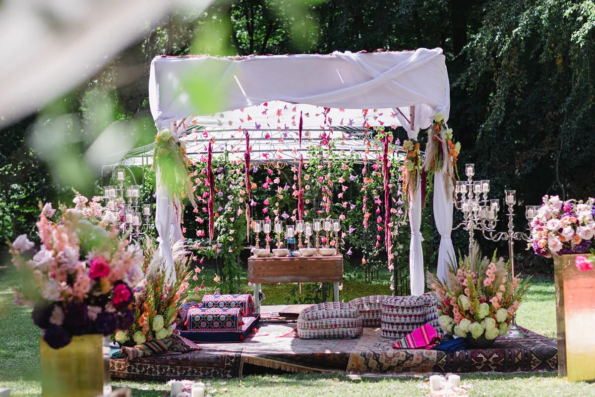 Floral ceremony canopy and lounge set-up on a garden lawn, High Emotion Weddings