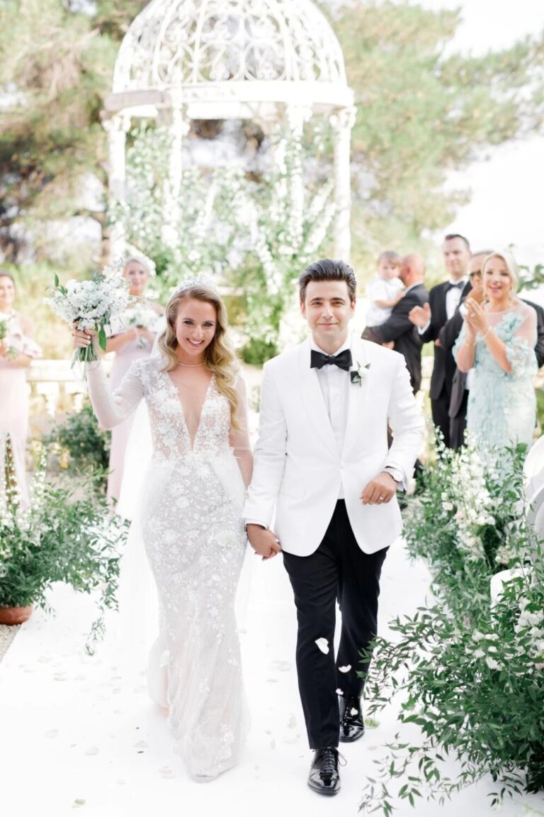 Couple walking back along the aisle under a white gazebo at Chateau Saint-Georges, Grasse, High Emotion Weddings