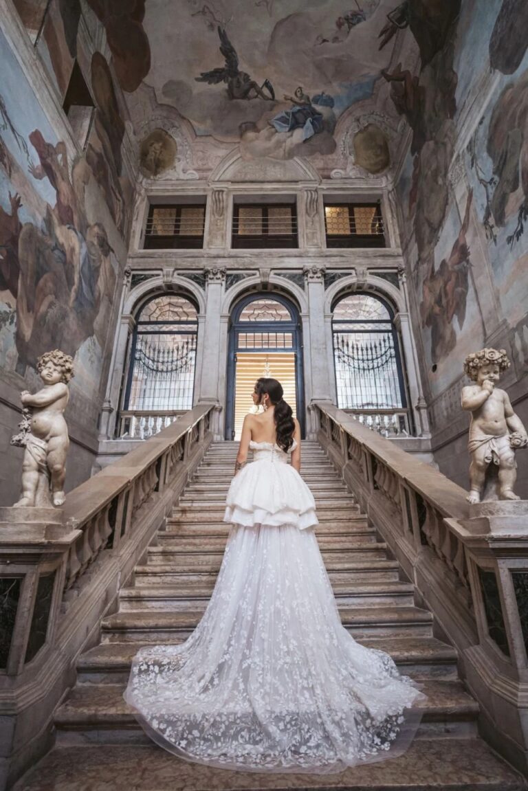 Bride on the grand staircase of Ca' Sagredo, Venice, High Emotion Weddings