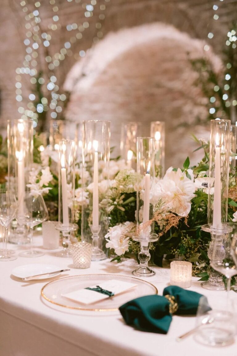 Table setting with emerald napkins and candles at Palais Coburg, Vienna, High Emotion Weddings
