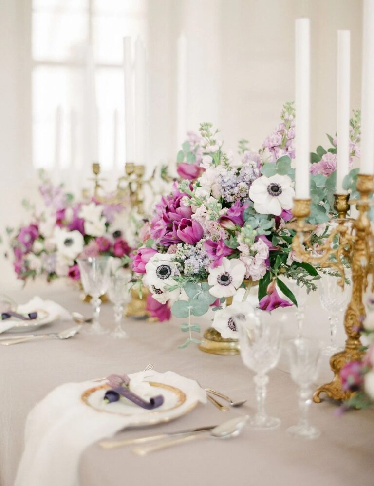 Spring table with anemones, candles and gold candelabra at Schloss Hof, High Emotion Weddings