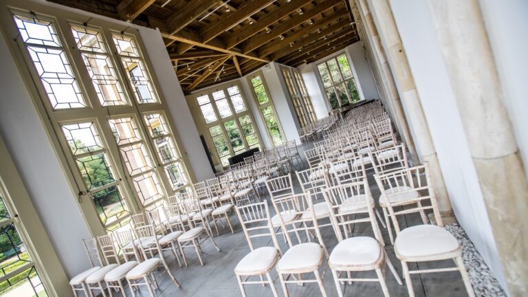 The Wintergarden set with chairs for a ceremony, Highcliffe Castle
