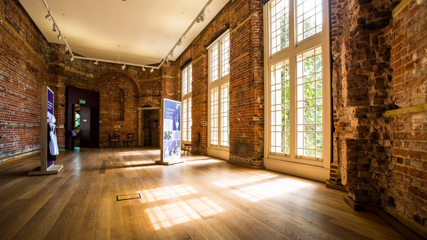 A state room with a wooden floor and tall windows, Highcliffe Castle