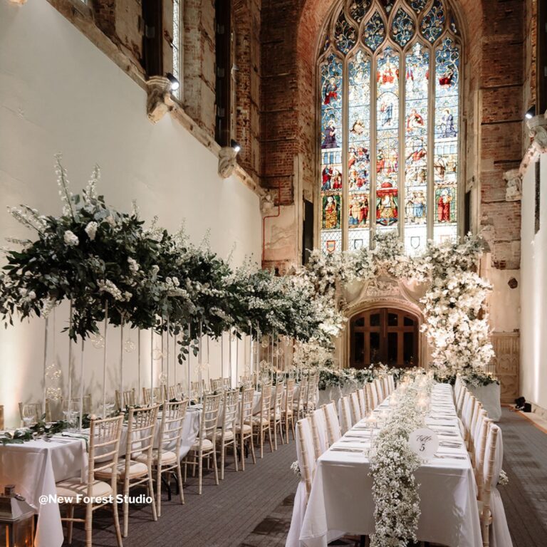 The Great Hall set with long tables under hanging flowers, Highcliffe Castle