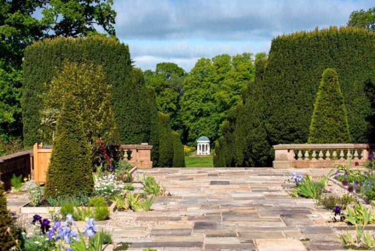 The paved garden terrace toward the Yew Tree Walk and Lady Alice's Temple, Hillsborough Castle and Gardens