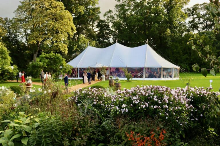 A white sailcloth marquee among the herbaceous borders, Hillsborough Castle and Gardens