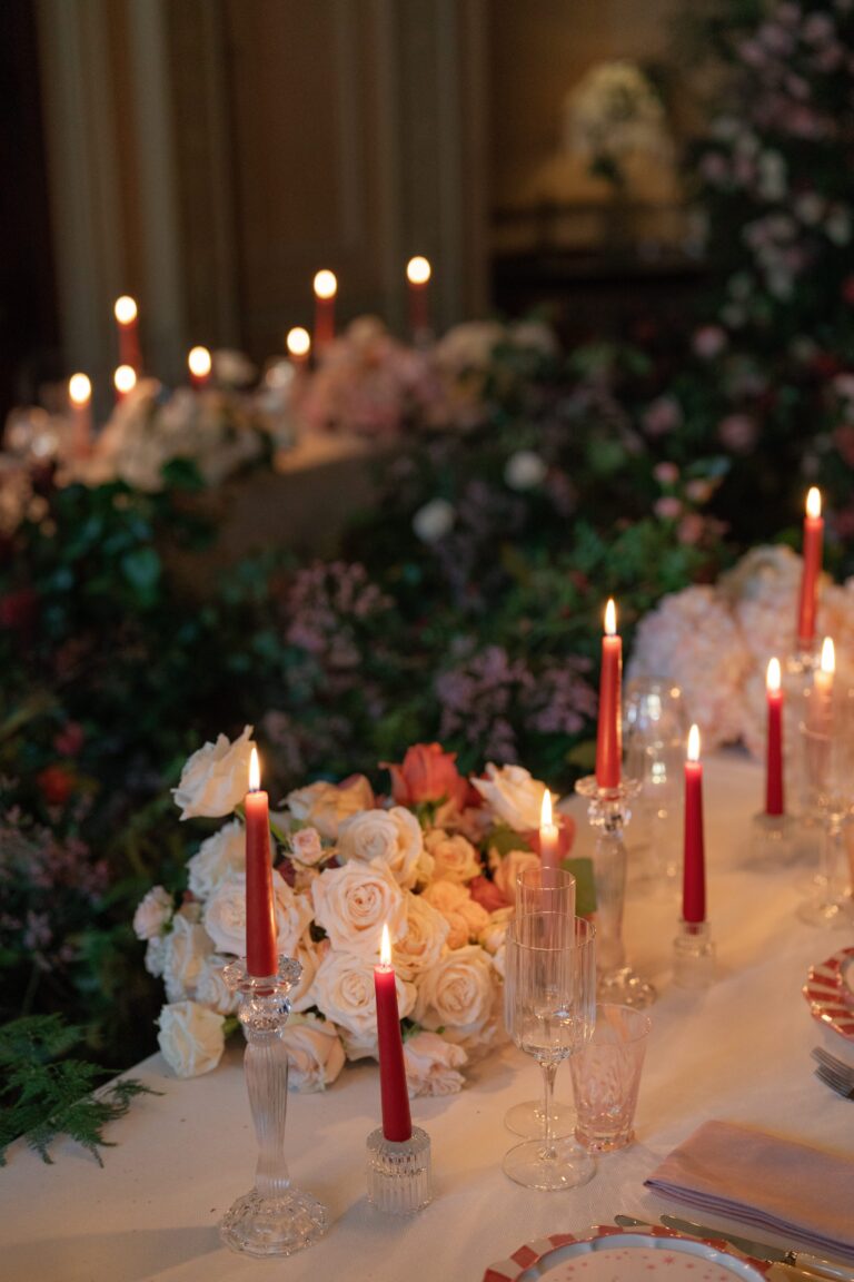 A candlelit table dressed with flowers, Home House