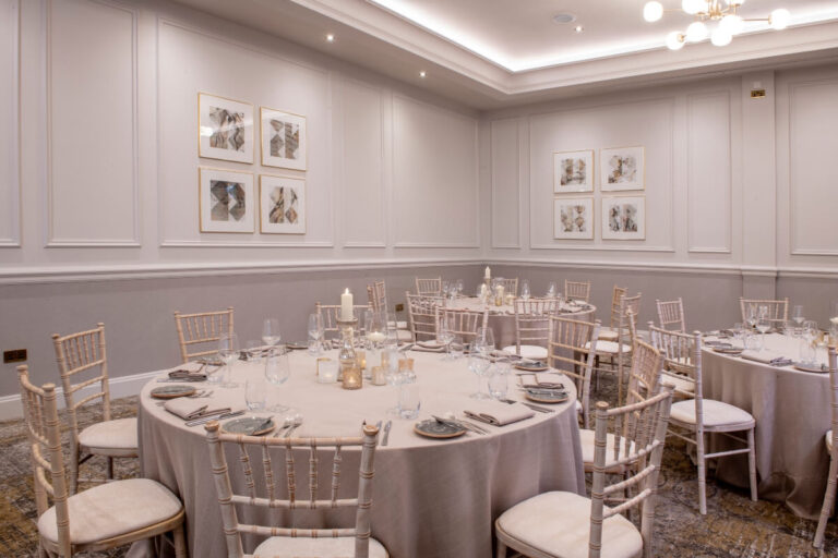 The Eyre Suite laid with round tables and chiavari chairs for a dinner, Horwood House Hotel & Spa