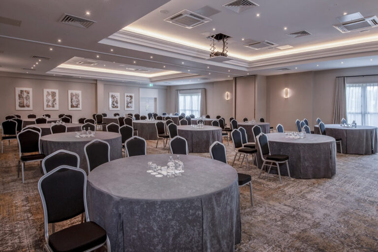 The Cook Suite, the largest events room, set with round tables, Horwood House Hotel & Spa