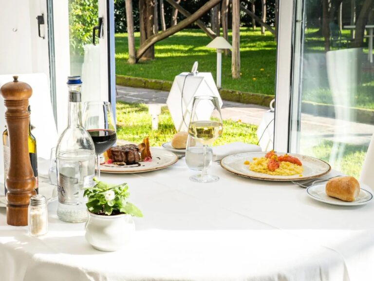 Lunch at the restaurant, the garden opening beyond the windows, Hotel Alpha