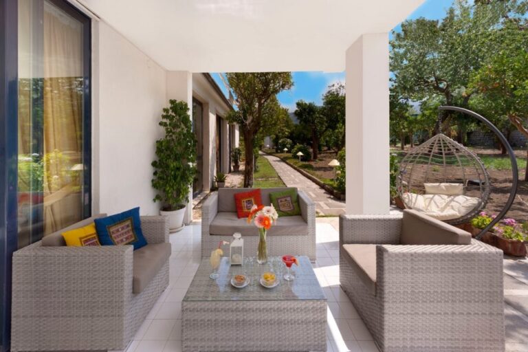 A patio terrace with garden hammock and grove views, Hotel Alpha
