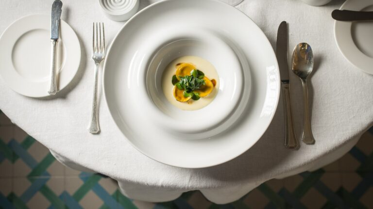 A plated dish on a laid table, Hotel Santa Caterina