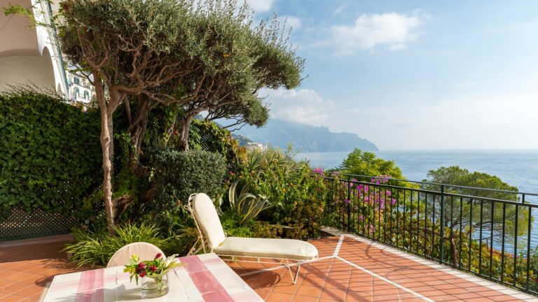 A terrace with a sun lounger overlooking the coast, Hotel Santa Caterina