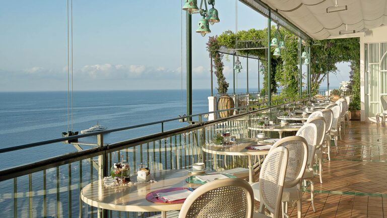 Tables laid on the veranda terrace, Hotel Santa Caterina