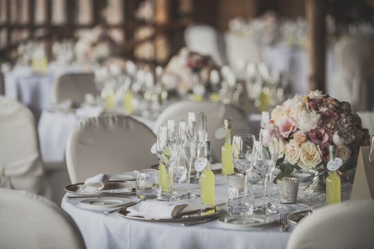 Reception tables laid with flowers and glassware, Hotel Santa Caterina