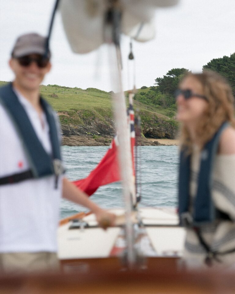 A couple sailing on the Pinuccia, the hotel's classic yacht, Hotel Tresanton