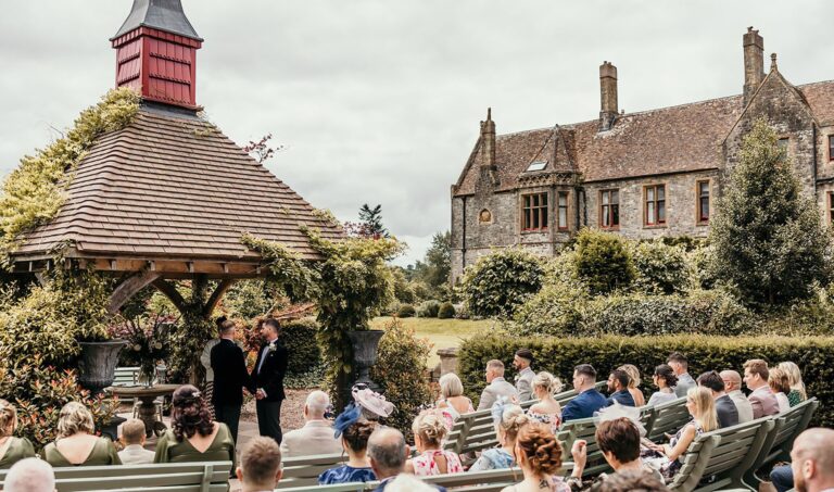 A ceremony on the lawn beneath a gazebo, Huntsham Court