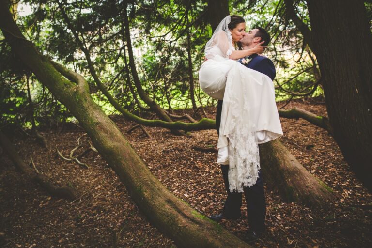 A couple among the trees in the grounds, Huntsham Court