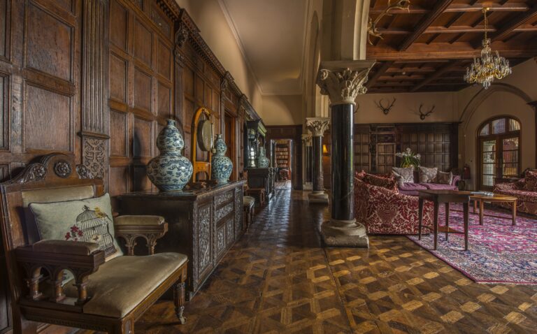 The Great Hall with its panelling and parquet floor, Huntsham Court