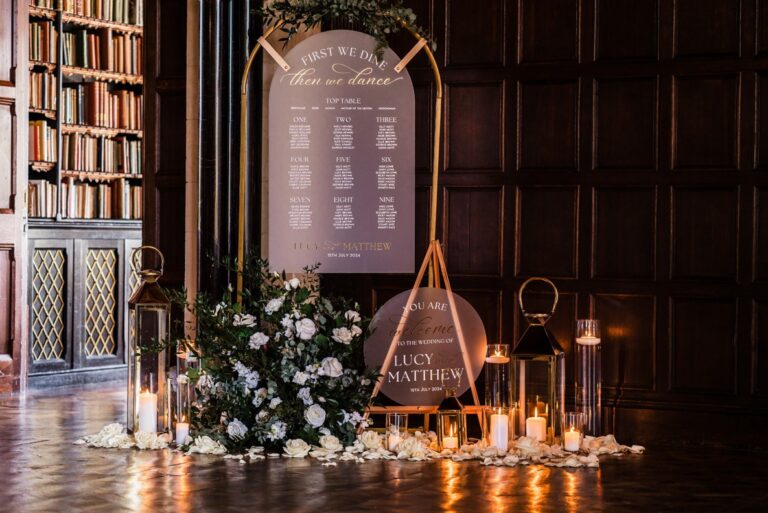 The Library set with a seating plan and candles, Huntsham Court
