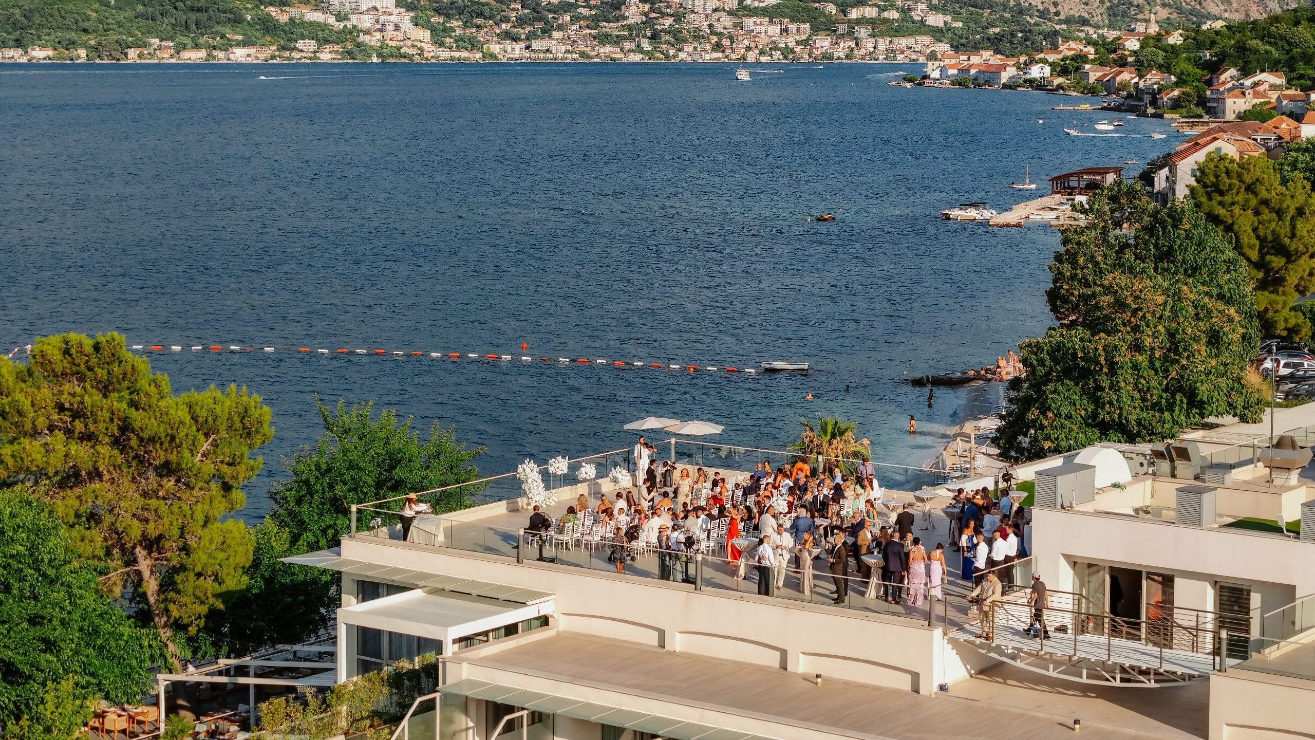A rooftop wedding ceremony with guests and the bay below, Hyatt Regency Kotor Bay Resort