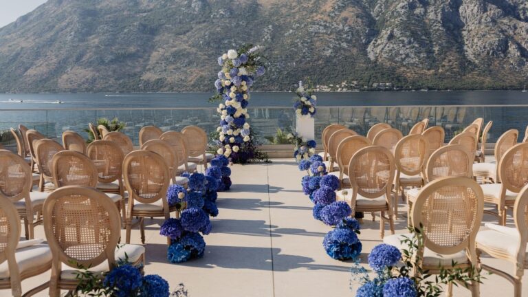 Chairs and blue floral arrangements for a rooftop ceremony, Hyatt Regency Kotor Bay Resort