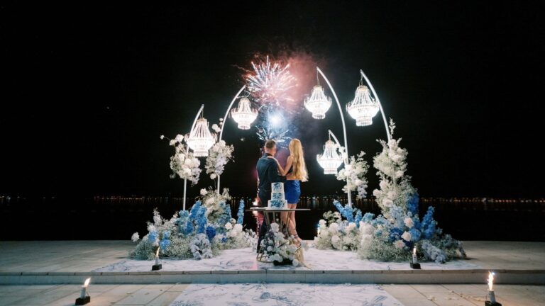 A couple under a floral arch at night by the Lighthouse restaurant, Hyatt Regency Kotor Bay Resort