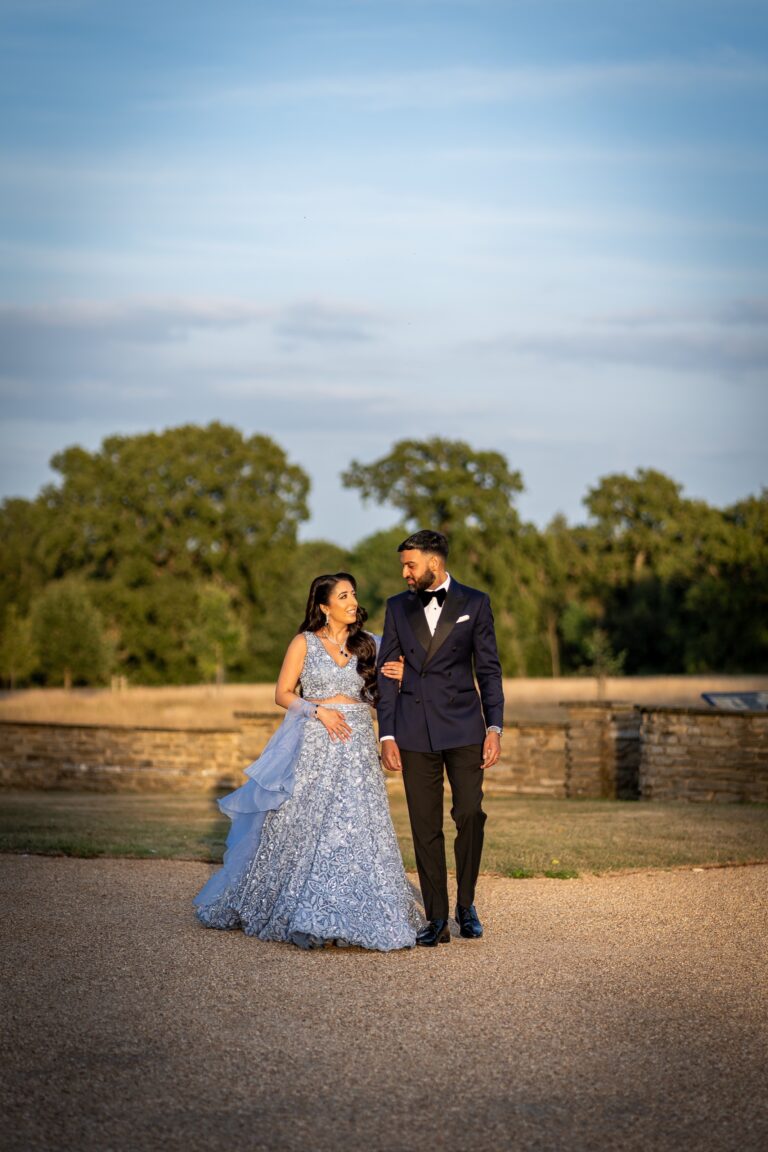 The couple in open parkland under a wide sky, Hylands Estate