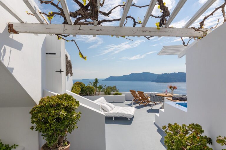 A pergola terrace with sun loungers and a sea view, Ikies Traditional Houses