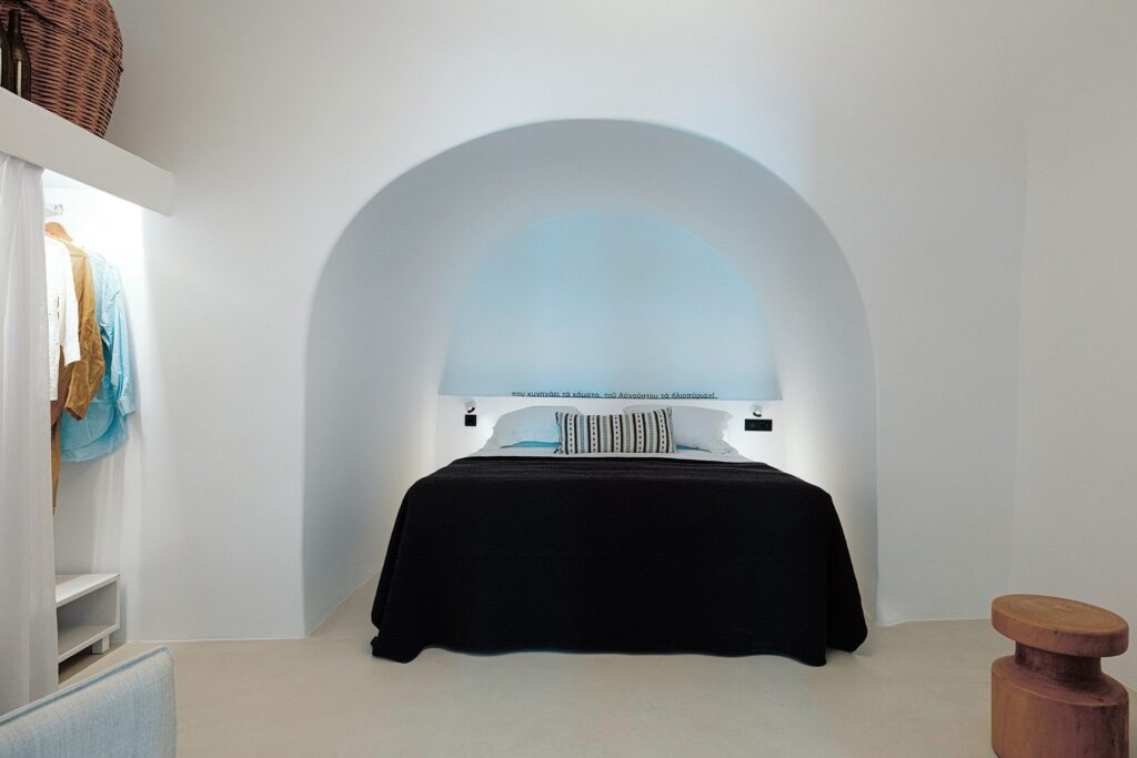 The Winemaker's Suite bedroom in a vaulted niche, Ikies Traditional Houses