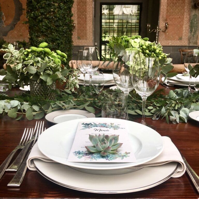 Place setting with a succulent laid on a watercolour menu, eucalyptus runner behind, Il Mio Matrimonio