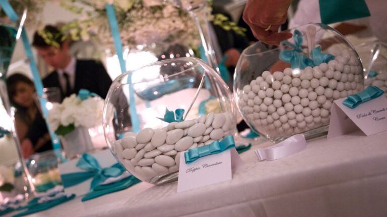 Sugared almonds in glass bowls tied with teal ribbon, on the confettata table, Il Mio Matrimonio