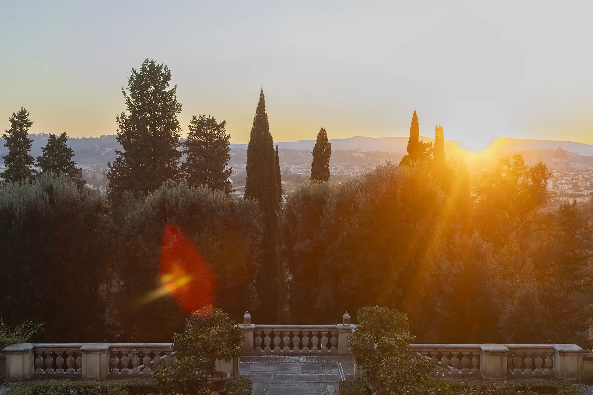 The gardens at golden hour, stone balustrade above Florence, Il Salviatino