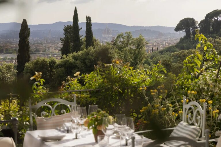 A table set for dinner on the garden terrace above Florence, Il Salviatino
