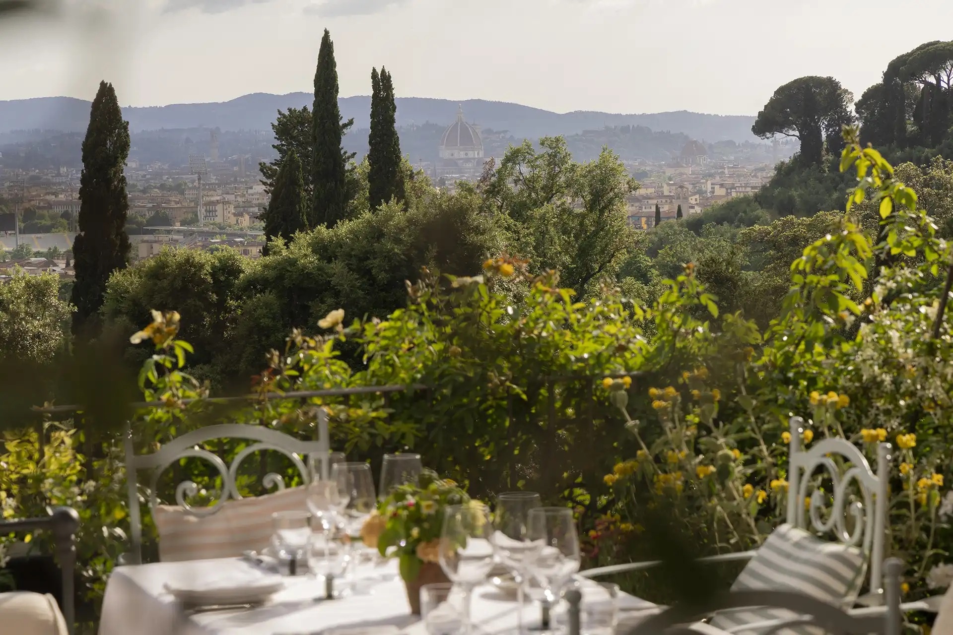A table set for dinner on the garden terrace above Florence, Il Salviatino