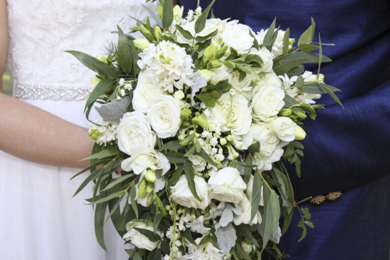 A bride's bouquet of white rose and freesia, In Water Flowers