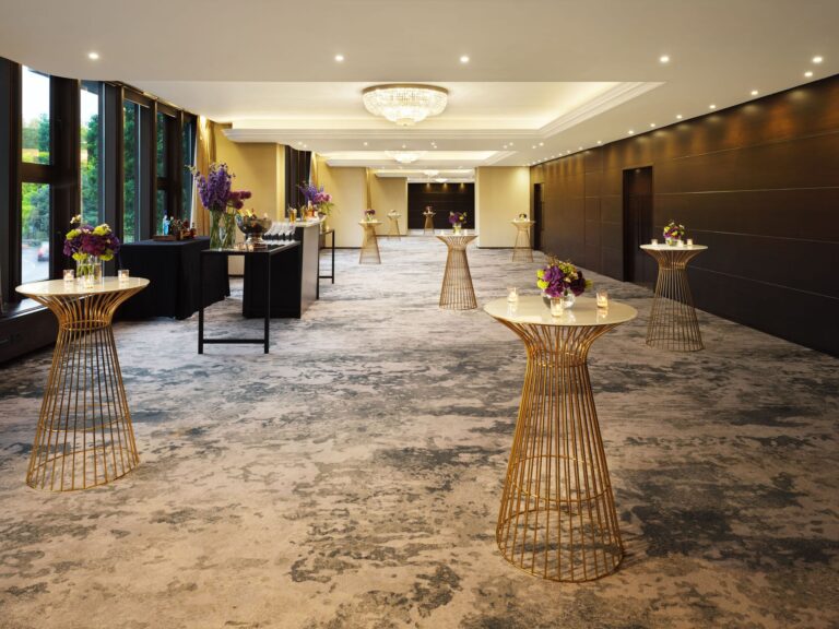 Roman to Grays set for a standing drinks reception with gold poseur tables along the Park Lane windows, InterContinental London Park Lane