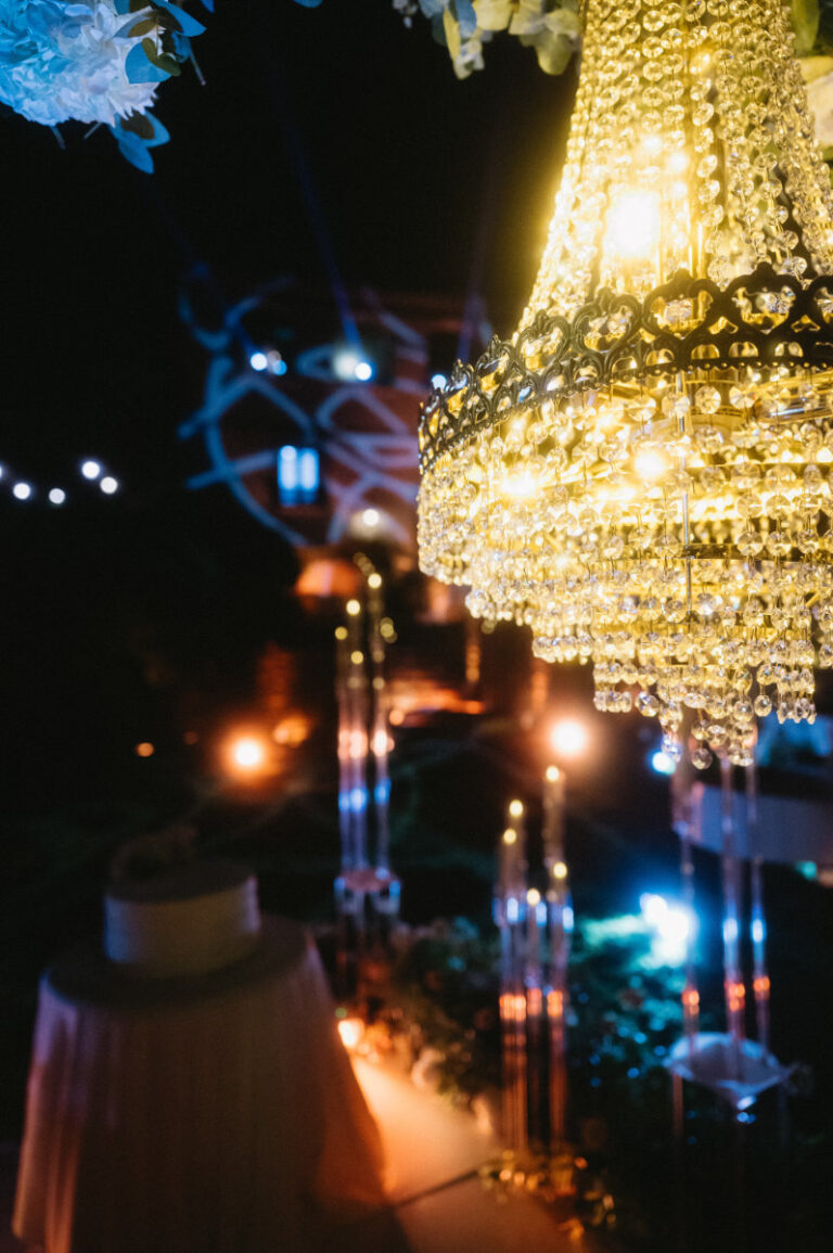 A crystal chandelier lit above the dinner after dark at Domus Laeta, Iole Criscitiello