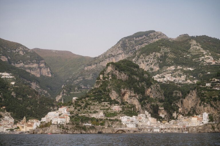 The Amalfi Coast seen from the water, villages stacked into the cliffs, Iole Criscitiello