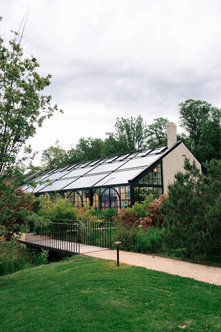 The glasshouse beside the lawn and garden path, Iris Orangerie