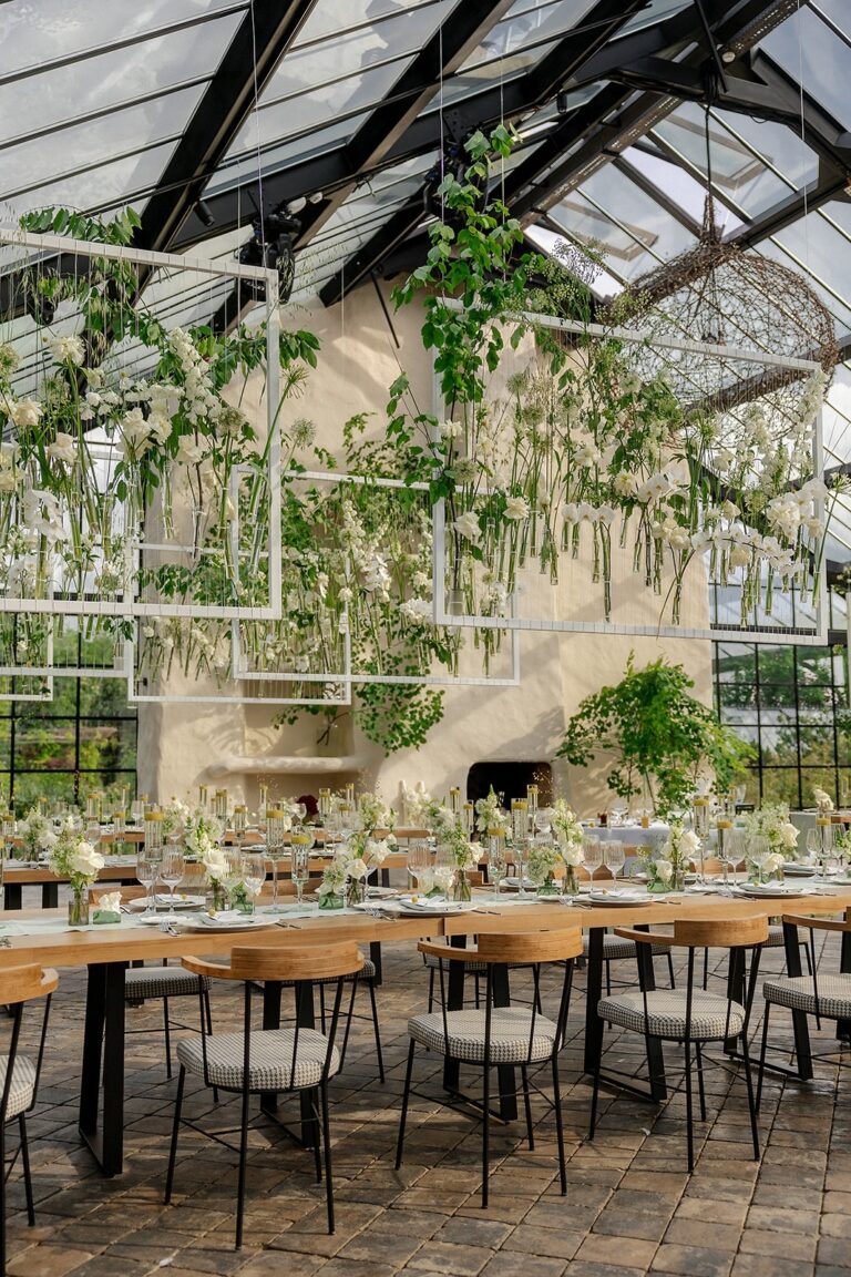 Dining tables under planting inside the glasshouse, Iris Orangerie