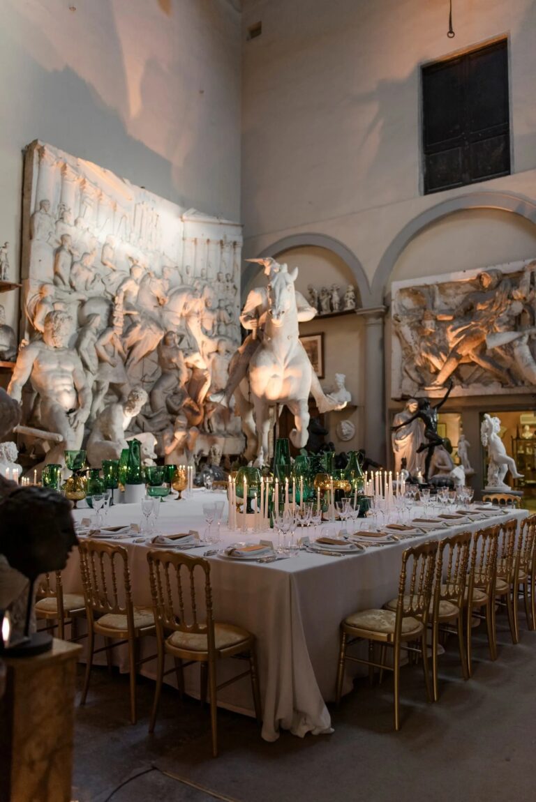The same Florentine gallery with a table set in green and amber glass before ancient marble reliefs, Italian Eye
