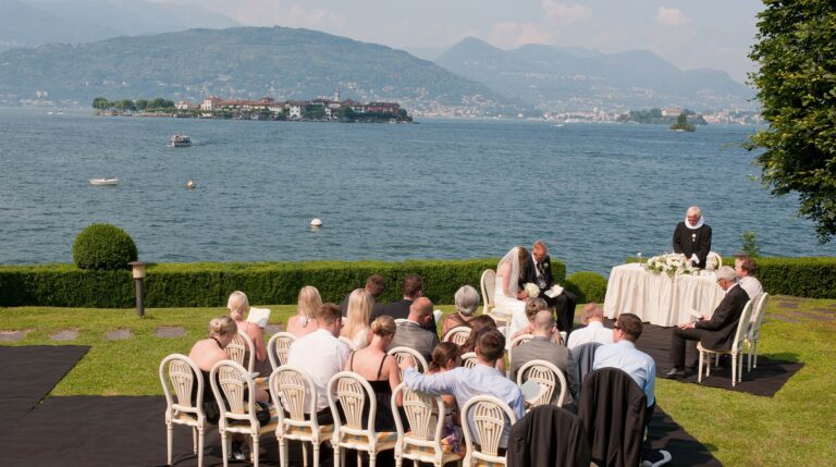 A Protestant ceremony on a lakeside lawn in Stresa, Lake Maggiore, with the islands across the water, Italian Wedding Company
